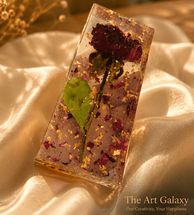 Flower and bouquet preservation in resin Preserved red roses from a bouquet set in clear resin as a keepsake artwork